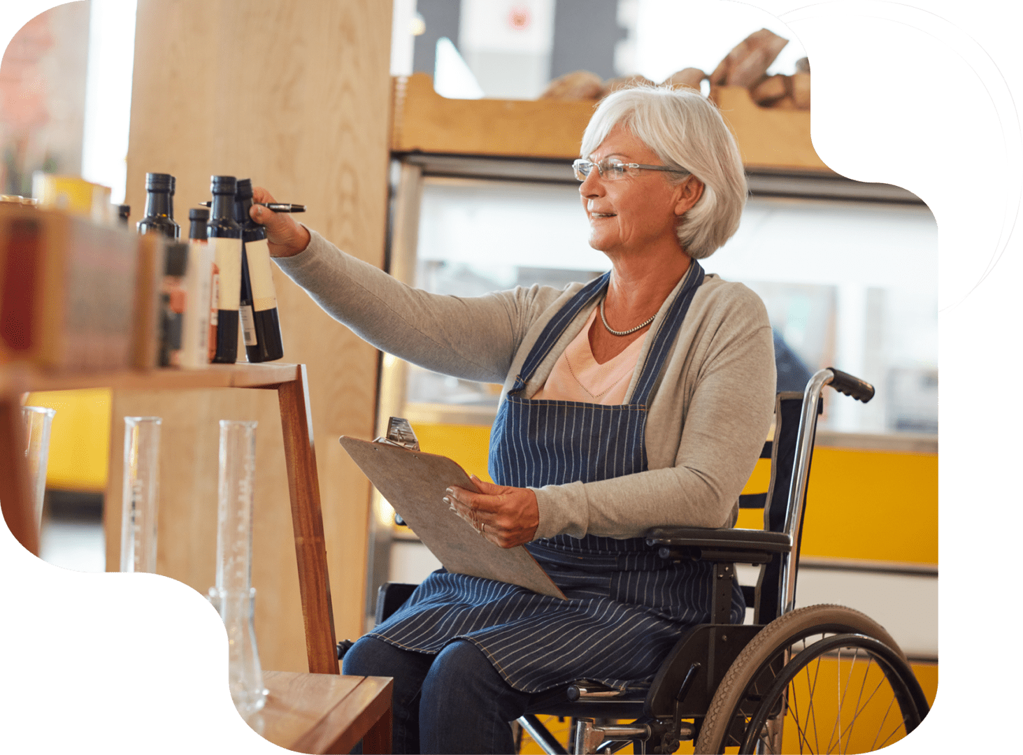 A woman in a wheelchair holding onto some papers